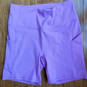 Fabletics Powerhold Bike Shorts purple size medium NWT. 1560